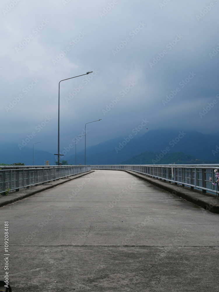 The path is made of cement. The path is made of cement.