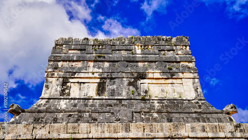 Jaguars frieze with Mayan motifs and relief decorations on top of the Temple of Jaguars near the Great Ball Court or Juego de Pelota in the Great Mayan temple complex of Chichen Itza,Yucatan,Mexico  photo