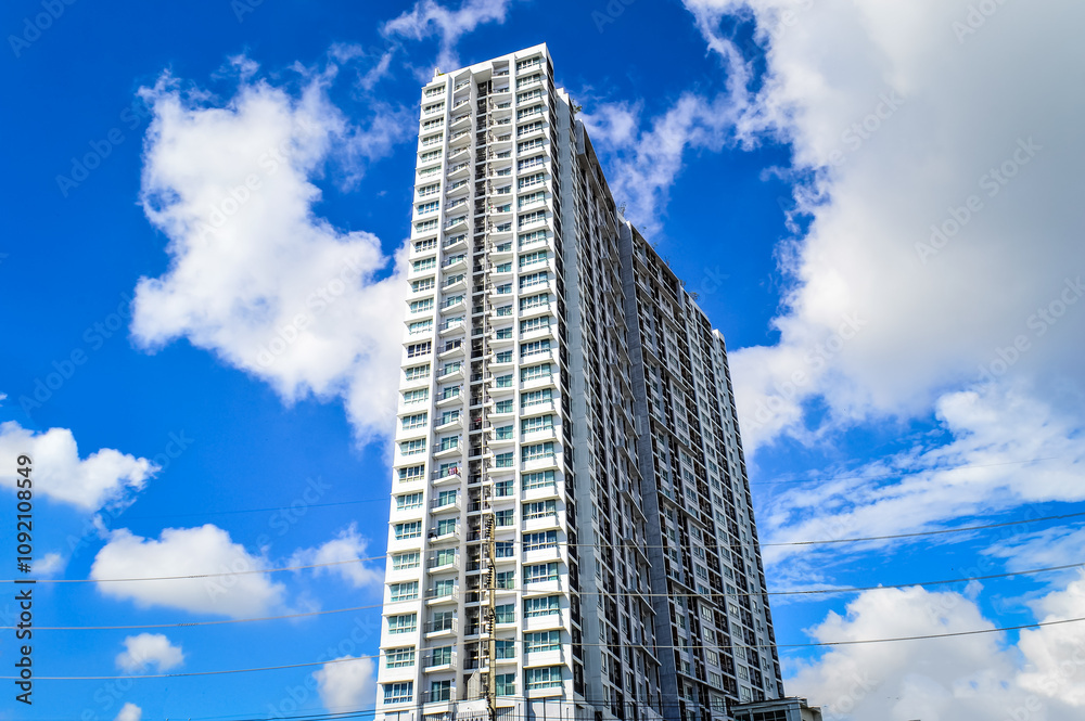 Super High-rise Apartment Complex with white cloud and blue sky background Super High-rise Apartment Complex with white cloud and blue sky background