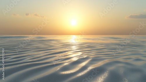 A serene sunset over a calm ocean with a warm, golden glow reflecting on the water.