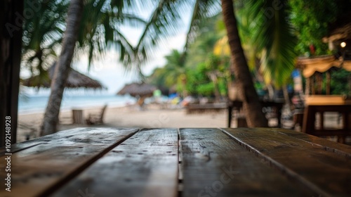 Wooden table with blurred beach background.