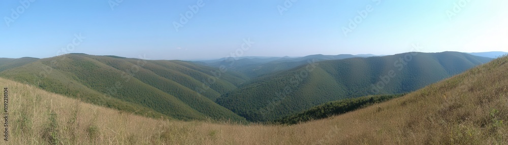 Vast rolling hills under a clear blue sky. Vast rolling hills under a clear blue sky.