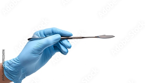 A surgical curette with a polished finish, angled to show its curved tip. isolated white background photo