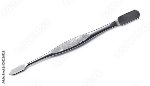 A surgical curette with a polished finish, angled to show its curved tip. isolated white background photo