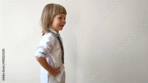 A little boy dressed in Ukrainian traditional clothes, vyshyvanka. Smiling child looking at the camera. Portrait of a little kid smiling child looking at the camera. Children's smile. Close-up face