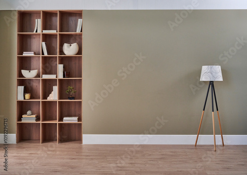 Room interior concept, bookshelf, frame, lamp, vase of plant, chair, carpet detail. Modern wall.