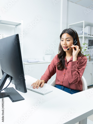Asian call center, woman technical support with headset talking to clients for customer service, online advice, telemarketing, CRM Marketing  and helpdesk in office, Customer support and telesales.