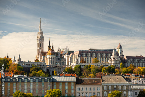 Budapest landscape. Wide angle photo with Budapest castle, Matthias Church and other landmarks of the city with Danube in foreground during an autumn day. Travel to Hungary.