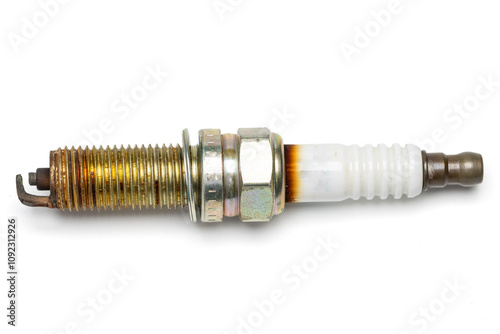 used spark plug with burned marks. isolated in white background.