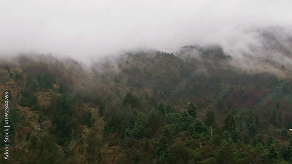 Volcanic Mountain Peaks Shrouded By Fog And Clouds At Volcan Nevado de Colima National Park In Mexico. - aerial shot Volcanic Mountain Peaks Shrouded By Fog And Clouds At Volcan Nevado de Colima National Park In Mexico. - aerial shot