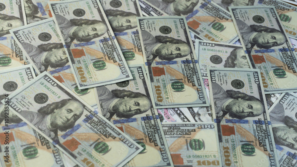 a large pile of hundred dollars USA money notes a large pile of hundred dollars USA money notes