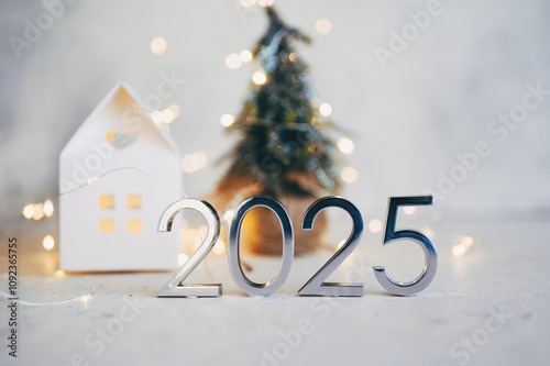 New Year's lights gold and dark red colors bokeh background with glowing number 2025 and fireworks. Happy New Year concept for 2025.