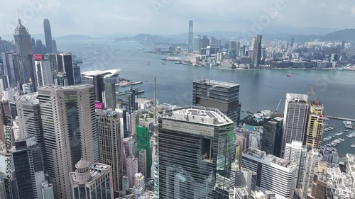 Aerial drone skyview of Hong Kong West Kowloon Victoria Harbour Financial Tsim Sha Tsui Hung Hom Central Admiralty Wan Chai Happy Valley Causeway Bay  photo