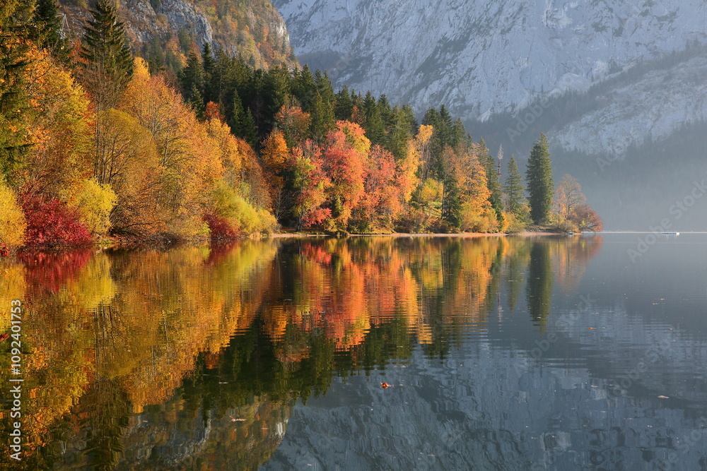 Fototapeta premium Colorful Autumn scenery and reflections on the lake Altausseer See in Altaussee, Bad Aussee, Salzkammergut, Styria, Austria, Europe