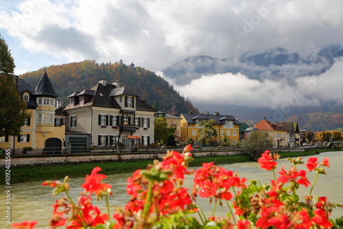 Obraz na płótnie Heritage buildings located along the river Traun in Bad Ischl, Salzkammergut, Styria, Austria, Europe, with mountains and clouds in the background w salonie