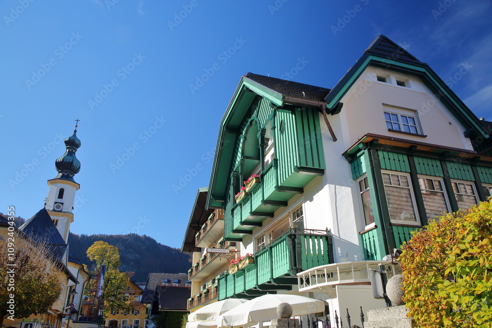 The church of Saint Egidius and colorful traditional wooden houses in Saint Gilgen, Wolfgangsee, Salzkammergut, Styria, Austria, Europe