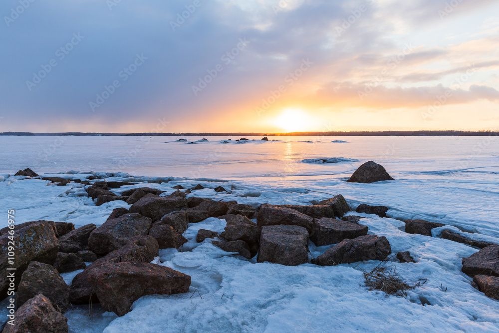 Obraz premium Granite rocks are covered with snow. Winter landscape