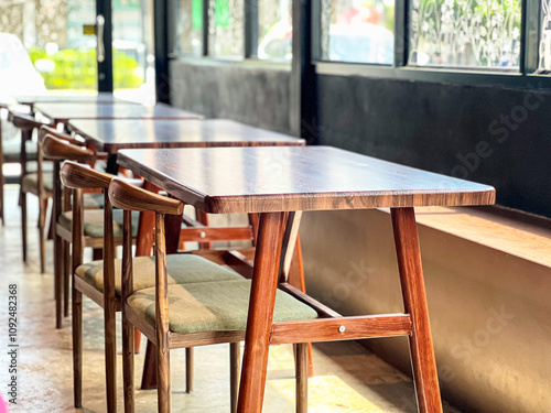 Wooden Tables and Chairs in Modern Coffee Shop, Cozy Interior Design, Sunlight Reflection, Contemporary Style