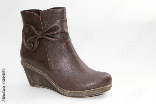 Women's boots. Short-throated. On a white background. Side view.