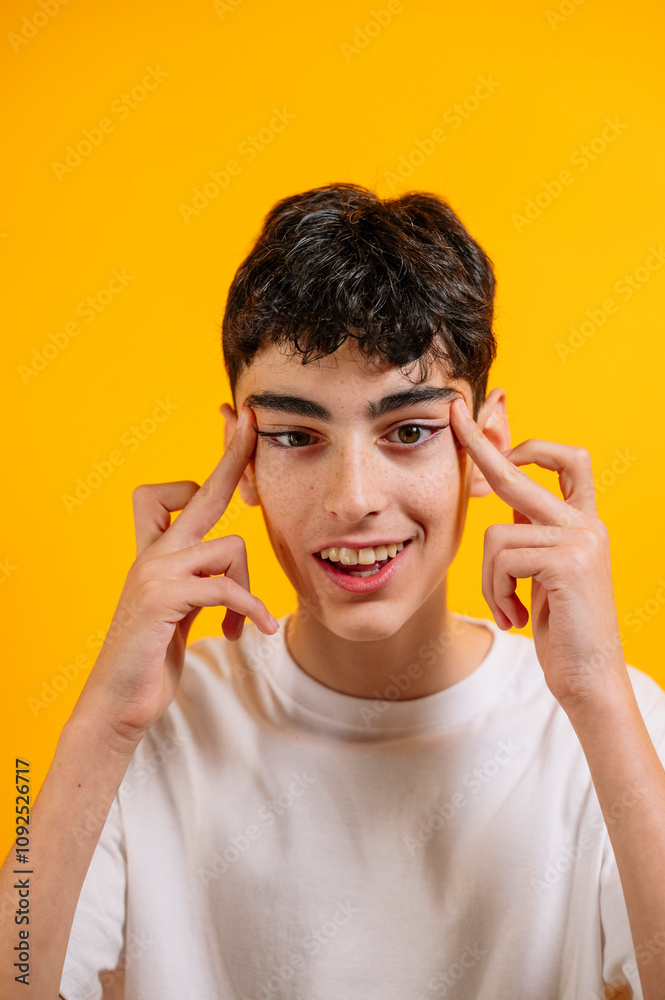 Smiling teenager thinking, with stretched eyes. Smiling teenager thinking, with stretched eyes.
