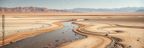 Dry riverbed in the middle of a vast desert, erosion, desolate landscape photo