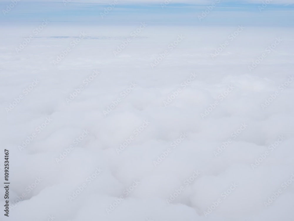 A vast expanse of stratocumulus clouds in shades of white and grey, covering the entire sky like a layer of fog, stratocumulus, perspective A vast expanse of stratocumulus clouds in shades of white and grey, covering the entire sky like a layer of fog, stratocumulus, perspective