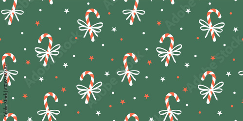 Seamless Christmas pattern with candy canes, bows and stars on green background. Winter vector decor. Sample for wrapping paper, fabric, cover.