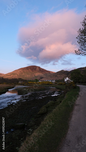 Scenic view of rural countryside landscape of Isle of Arran in Inner Hebrides of Scotland with clouds over mountainous terrain