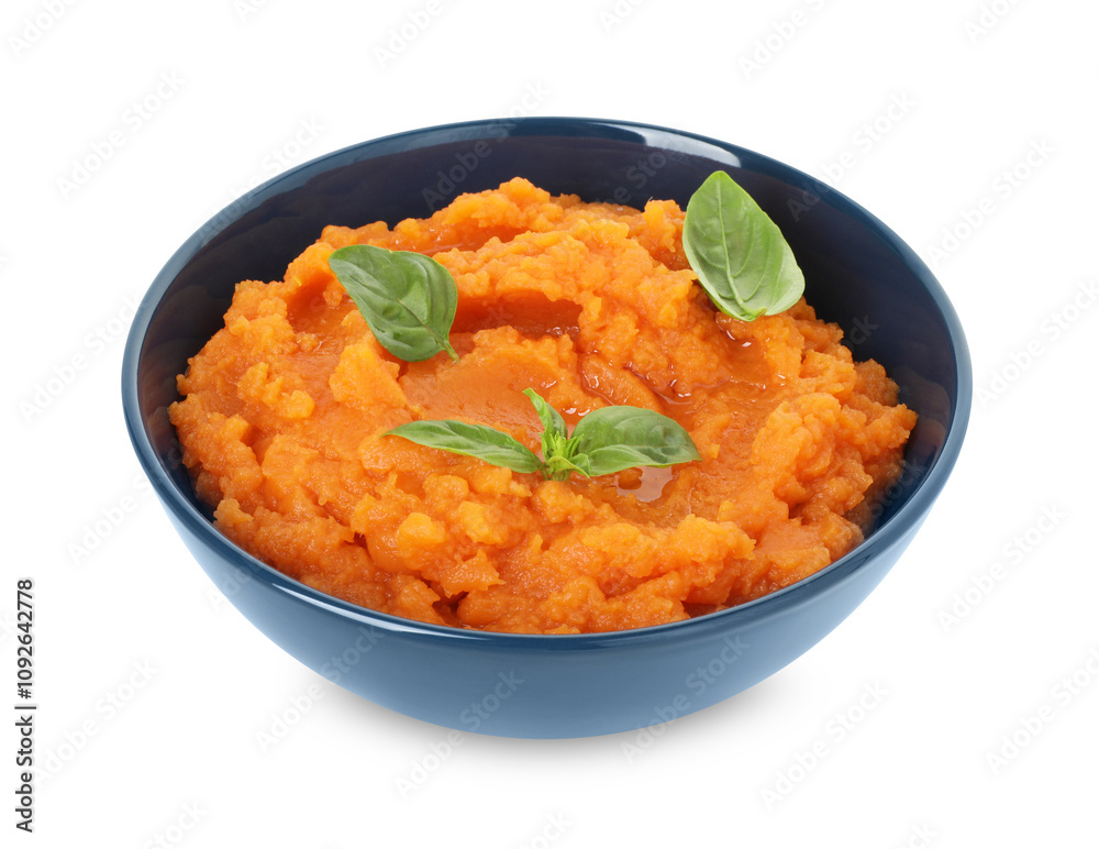 Tasty mashed sweet potato with basil in bowl isolated on white Tasty mashed sweet potato with basil in bowl isolated on white