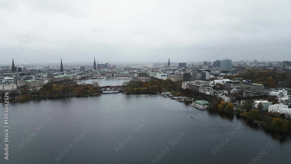 drone flying over a big lake with a beautiful city skyline, hamburg, germany, europe, drone drone flying over a big lake with a beautiful city skyline, hamburg, germany, europe, drone