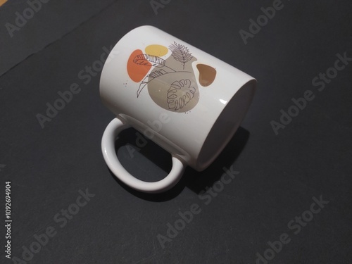 abstract designed white mug with black background