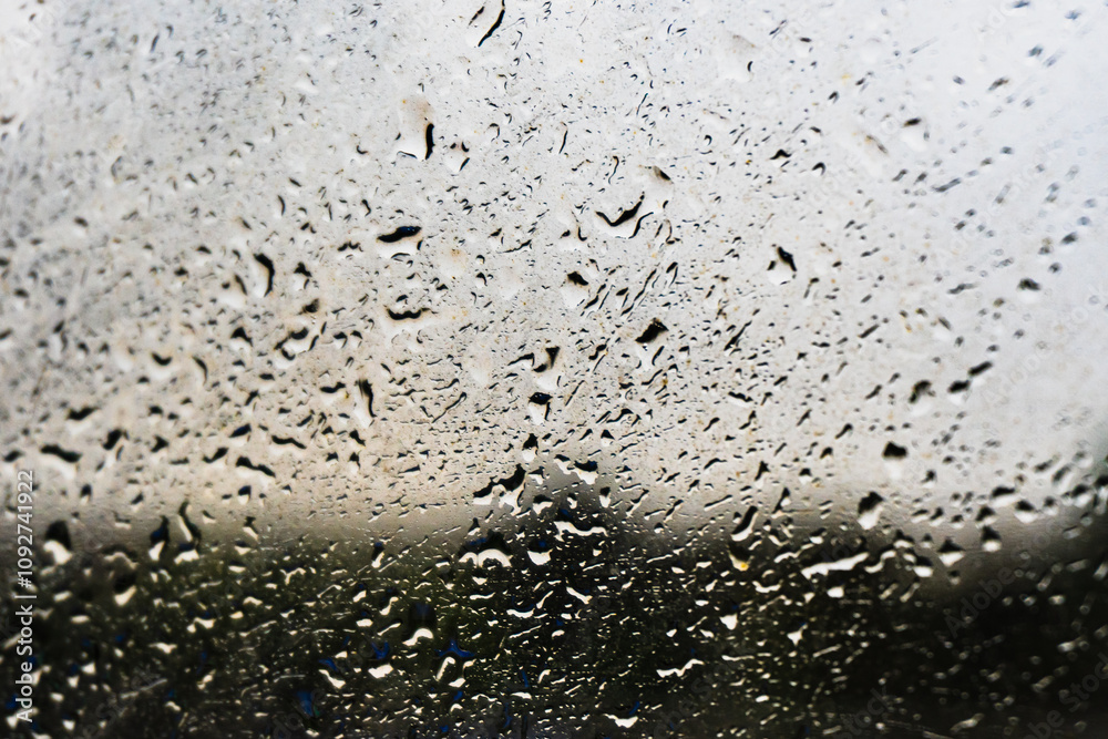 Raindrops on the window glass, shallow dof - abstract macro background.
Raindrops on the window glass, shallow dof - abstract macro background.