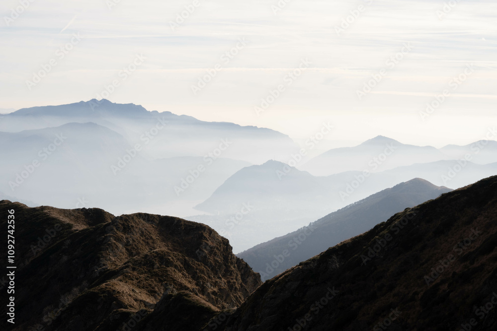 Fog in the high alps mountains in Switzerland's pristine nature, as seen from Monte Tamaro Fog in the high alps mountains in Switzerland's pristine nature, as seen from Monte Tamaro