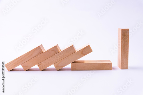 Five lying wooden blocks look at the side that stands. Copy space. photo