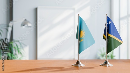 FLAGS OF KAZAKHASTAN AND SOLOMON ISLANDS ON TABLE photo