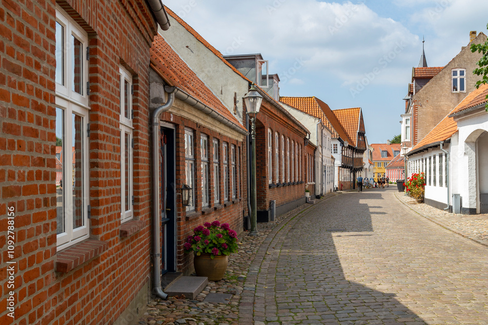 a beautiful city scape view through the small streets in the town Ribe in Denmark. With small and historic half-timbered houses in tiny alleys. a beautiful city scape view through the small streets in the town Ribe in Denmark. With small and historic half-timbered houses in tiny alleys.