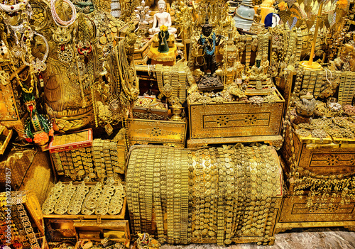 Картината върху платно Treasure cave with golden jewellery, treasure chests, pearls and statues in a Thai temple