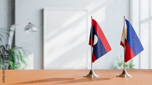 FLAGS OF LAOS AND PHILIPPINES ON TABLE