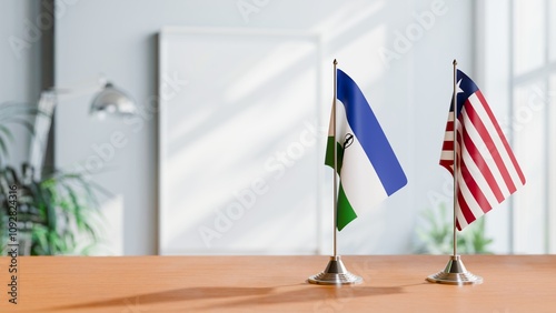 FLAGS OF LESOTHO AND LIBERIA ON TABLE photo