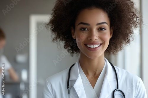 A confident doctor with a bright smile, wearing a white lab coat and stethoscope, exudes professionalism and warmth in a healthcare setting, ready to care. photo