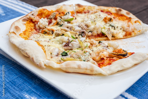 Seafood pizza with vegetables on table, Food background.