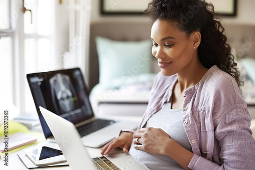 Pregnant Woman Having Virtual Prenatal Checkup in front of a laptop during a virtual consultation at home photo