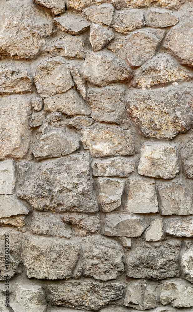 Texture wall stone sandstone with shadows and deep pattern. Vertical shot banner. Clinker tiles or bricks on the wall in the form of wild stone