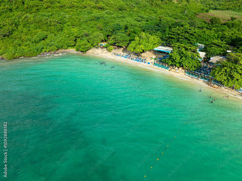 Aerial sea beach white sand green tropical forest with beach chair Aerial sea beach white sand green tropical forest with beach chair