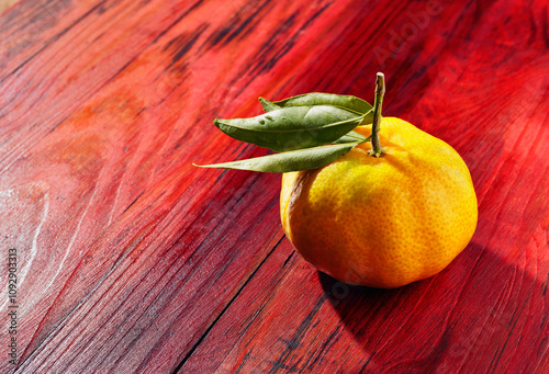 Ripe mandarin orange on wooden table