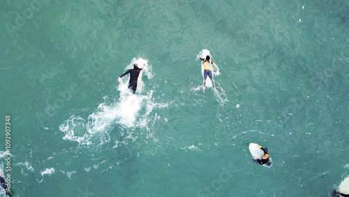 Photography Surfers on their boards are waiting for their next wave