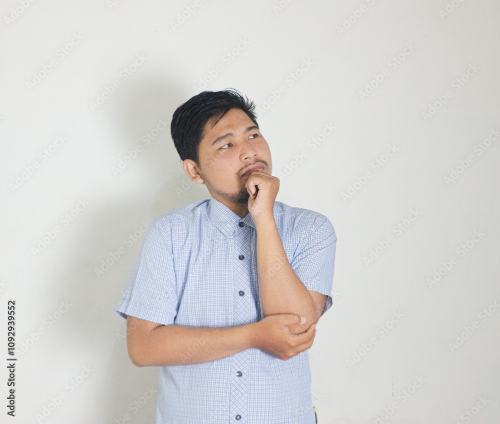 Confuse and pensive expression of handsome asian man Confuse and pensive expression of handsome asian man