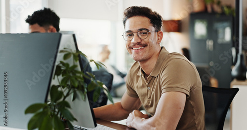 Photos Computer, portrait and web development with smile of man in creative workplace for coding or design