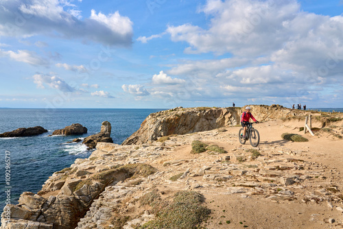 active senior woman cycling...