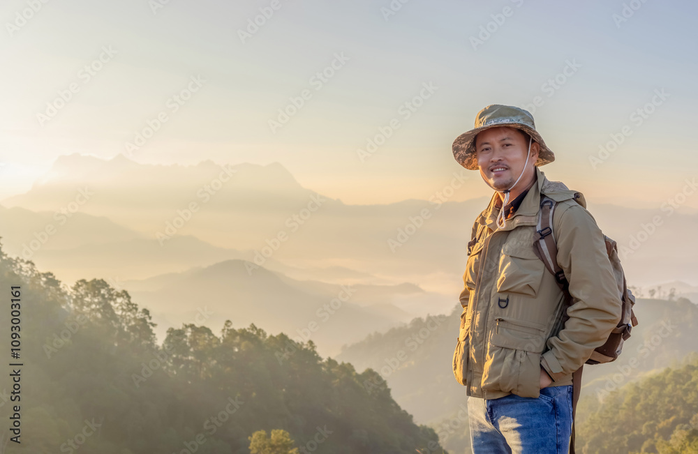 Portrait of young happy smiling asian male travel national mountain park in thailand. hiking and holiday lifestyle concept. Portrait of young happy smiling asian male travel national mountain park in thailand. hiking and holiday lifestyle concept.